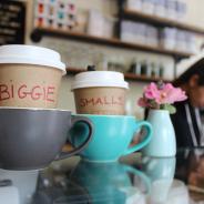 Cafe - Coffee Cups with worker in background