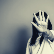 Domestic Violence and Financial Abuse thumbnail - Woman holding palm out