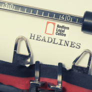 Close up of a typewritter that has just typed HEADLINES above which appears the RLC logo