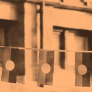 Three Aboriginal flags on a string - photo tinted orange