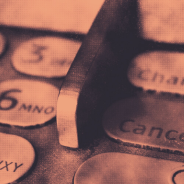 Closeup of ATM pinpad orange tinted image