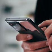 Close up of a person's hands holding a mobile phone