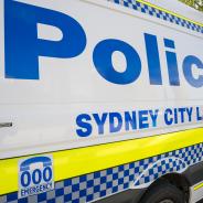 White Police van  with blue writing that reads Police Sydney City LAC