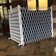 White wire strip search privacy screen at train station